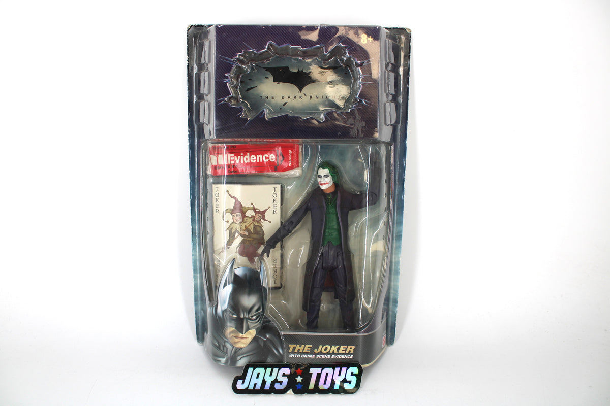 Joker Dark Knight Movie Masters 2008 Carded Figure — Card Front with Crime Scene Evidence Accessory and Joker Playing Card Visible