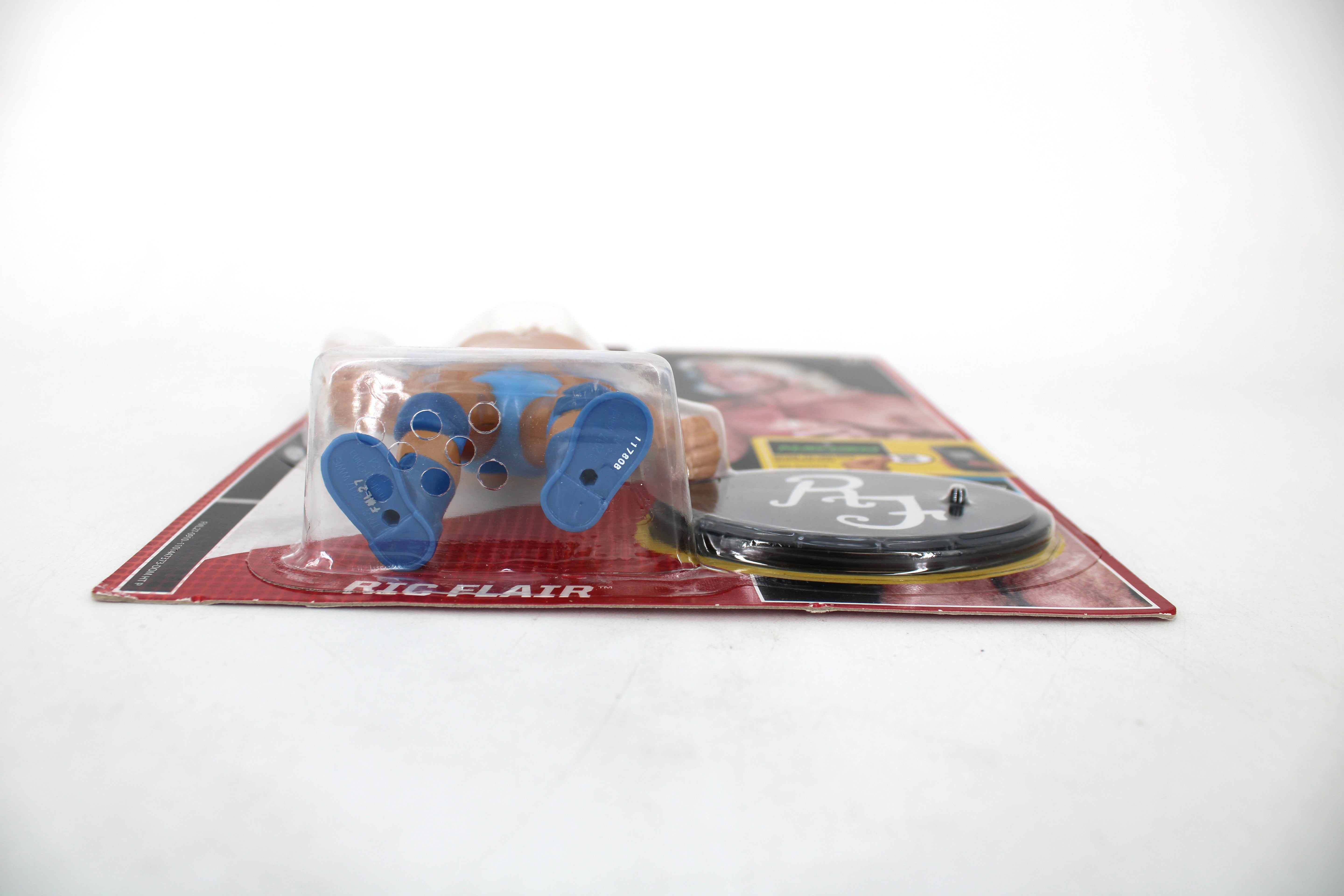 Ric Flair WWE Retro Series 4 Action Figure — Package Detail Showing Figure Feet and Display Base with Name Card