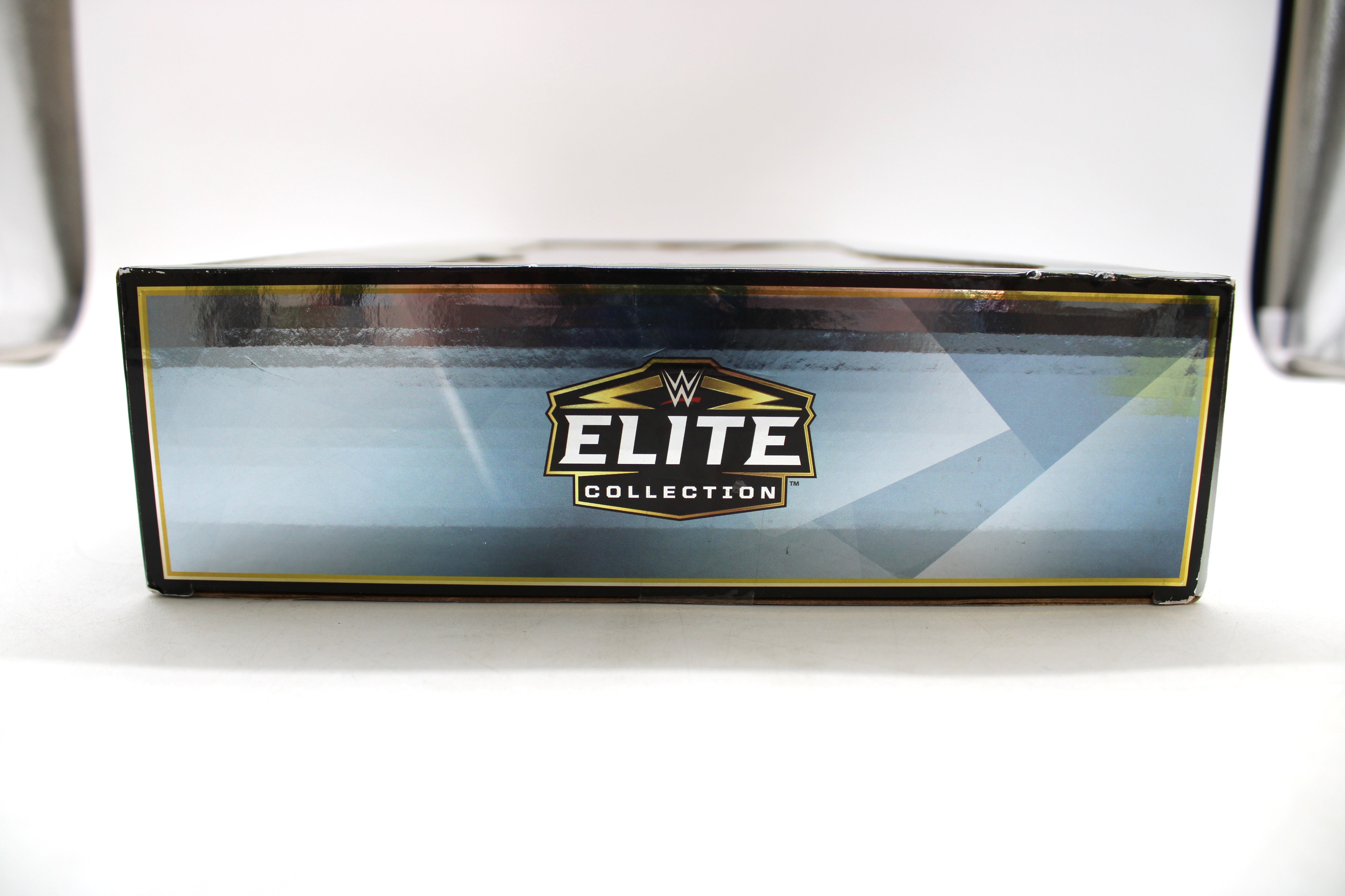 Hulk Hogan, Rocky Maivia, Stone Cold Steve Austin & Becky Lynch WWE Elite Collection 60th Anniversary 4-Pack — Box Art Close-Up of WWE Elite Collection Logo on Side Panel