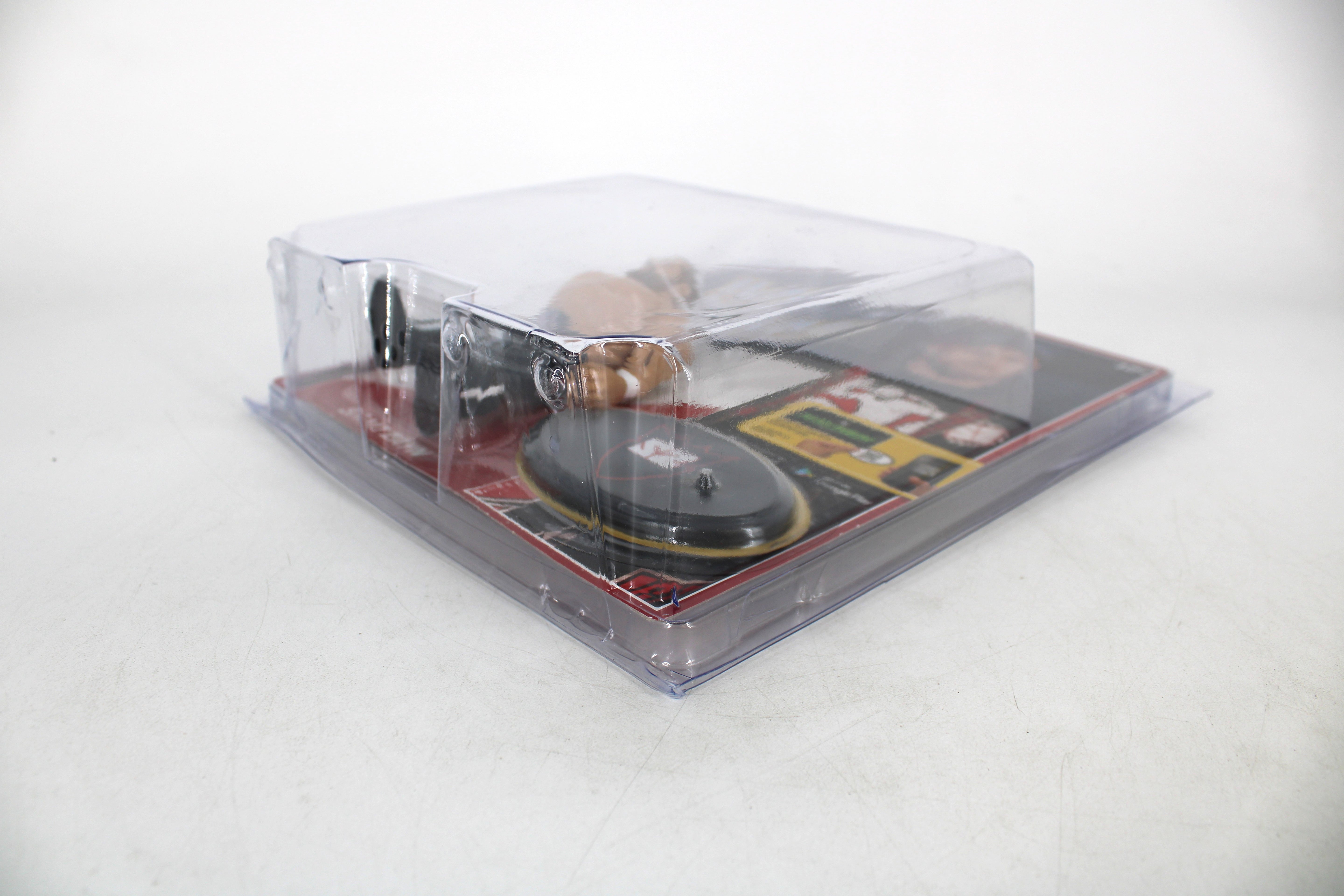 Sami Zayn WWE Retro Series Action Figure — Three-Quarter View Inside Protective Plastic Case with Card Back Visible