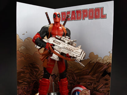 Deadpool McFarlane 1/6 Scale Figure — Close-Up Front View with Rifle and Comic Backdrop