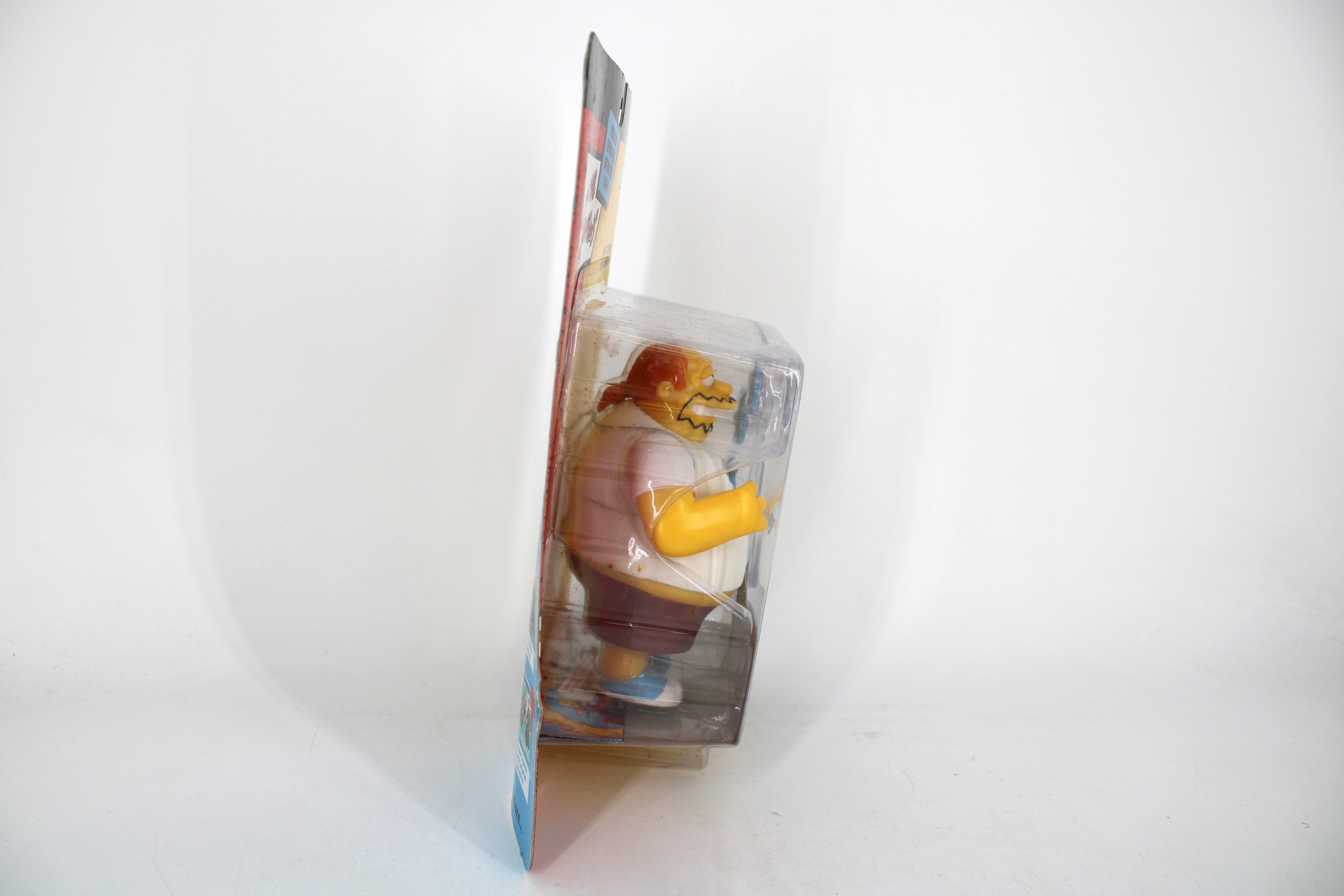 Comic Book Guy World of Springfield Series 15 Figure — Side View Left Showing Bubble Yellowing