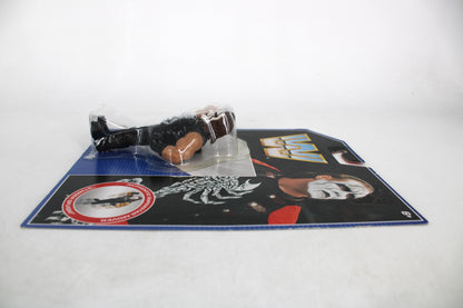Sting WWE Retro Action Figure — Side View with Card Art Showing Sting Portrait and WWE Logo