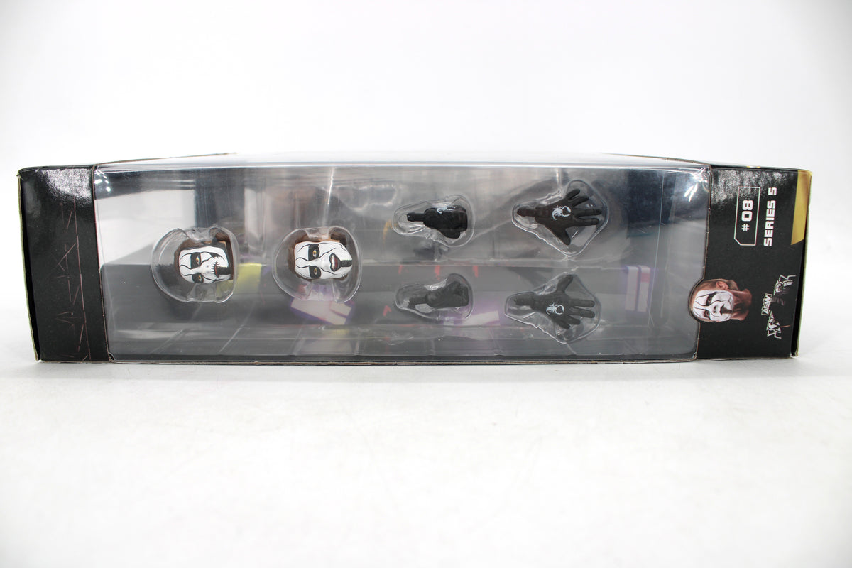 Sting AEW Unrivaled Supreme Series 5 Figure — Side Panel Accessory Tray Showing Alternate Head Sculpts and Spider-Logo Hands
