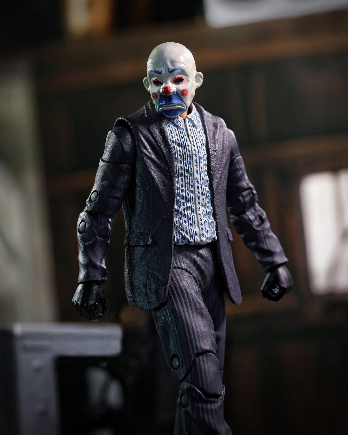 Joker Dark Knight DC Multiverse 7-Inch Figure — Clown Mask Head Front View in Warehouse Environment
