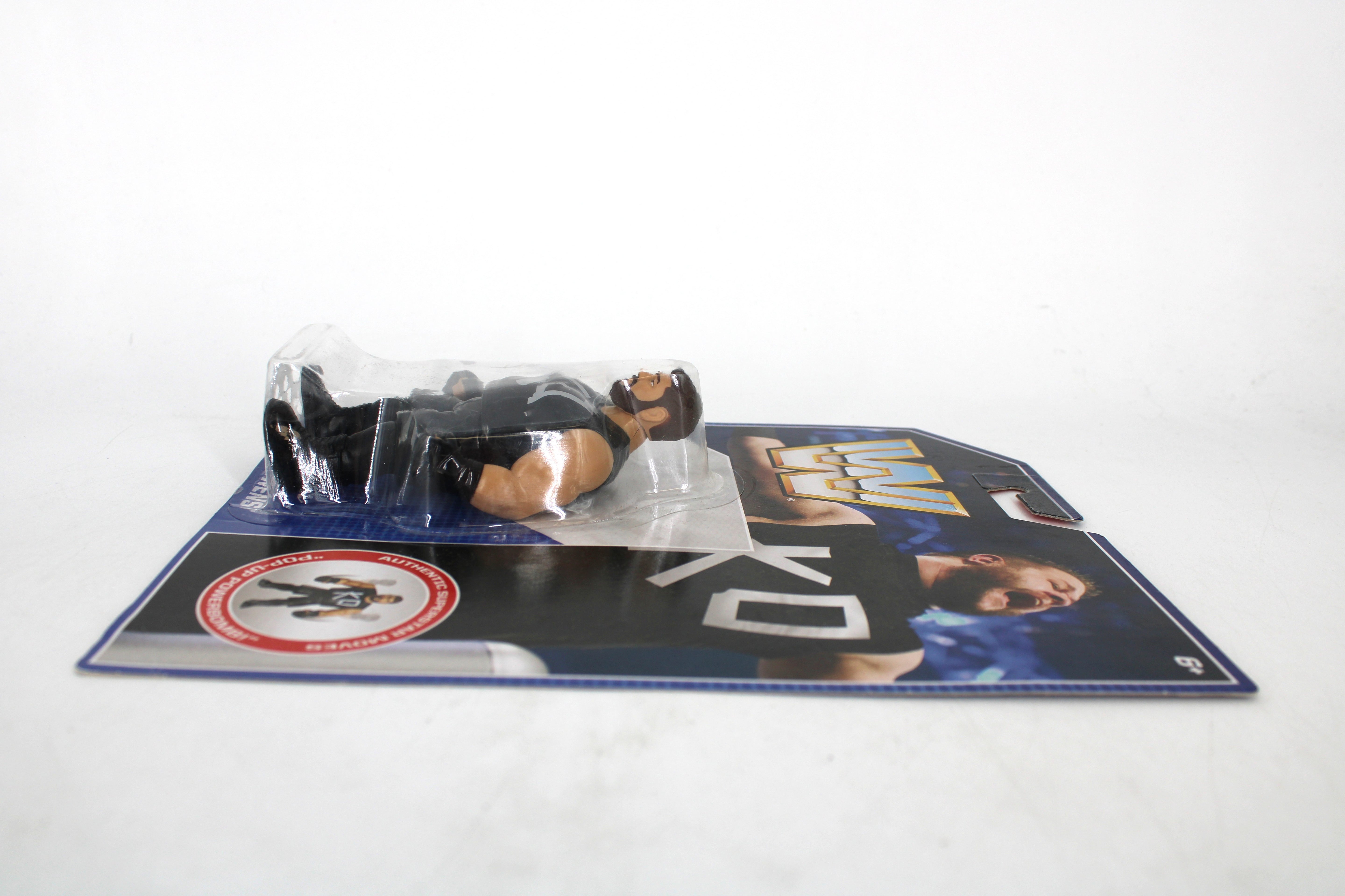 Kevin Owens WWE Retro Hasbro Style Figure — Side View of Carded Package Laid Flat