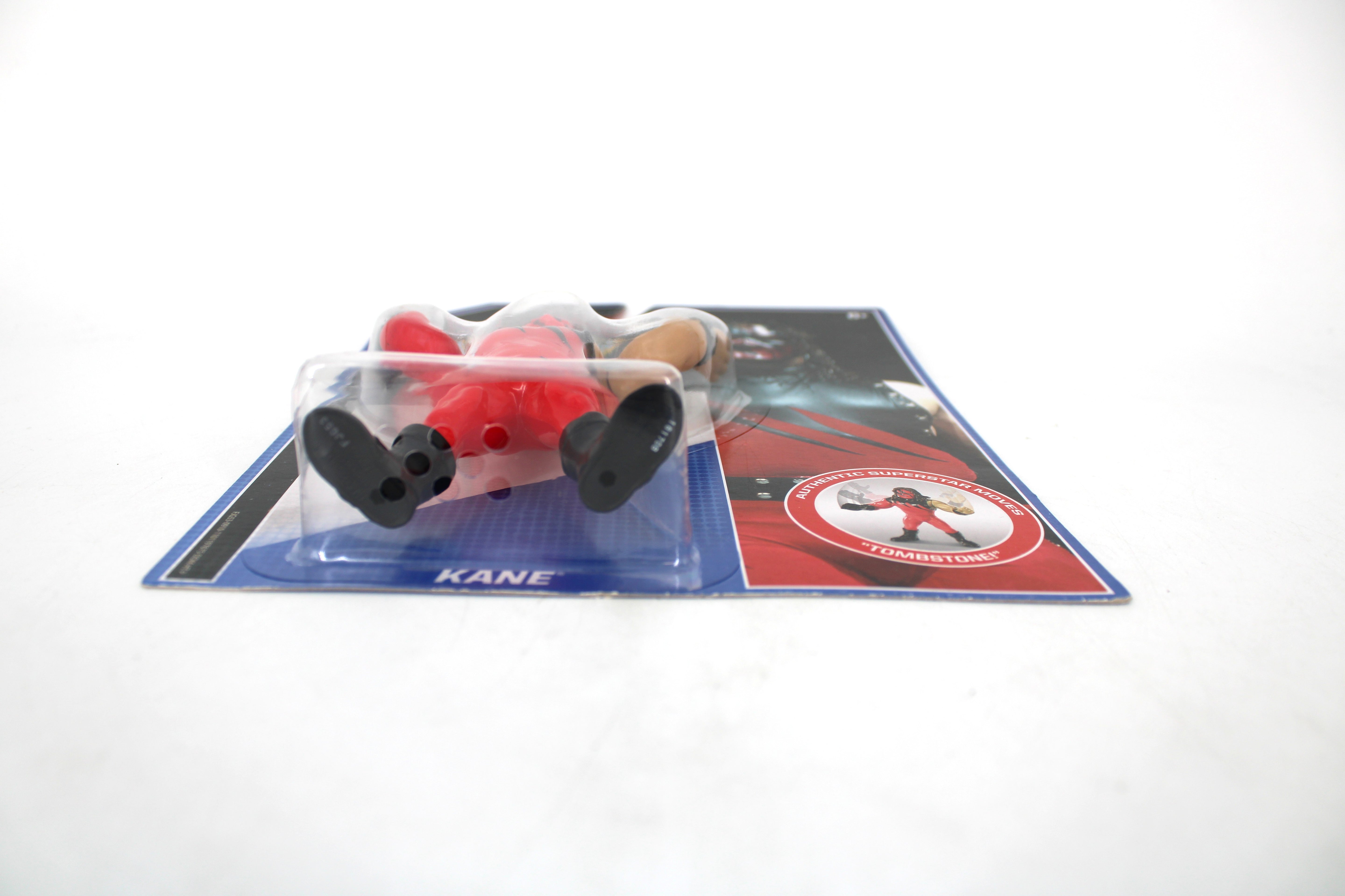 Kane WWE Retro App Series Action Figure — Low Angle Front View Showing Kane Name Card and Tombstoner Move Badge