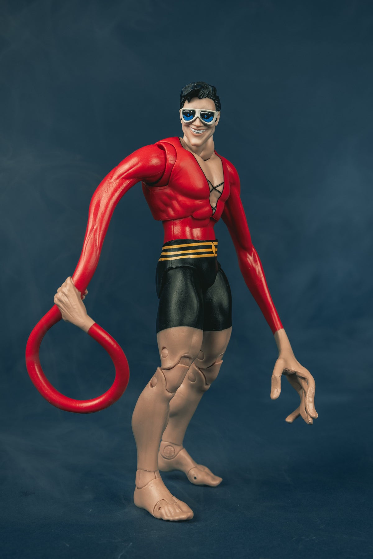 Plastic Man DC Multiverse 7-Inch Figure — Figure Detail Showing Looping Elongated Red Arm