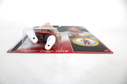 "Rowdy" Roddy Piper WWE Retros Action Figure (Kilt Kick) — Side View Showing Card Front Name and Kilt Kick Medallion Detail