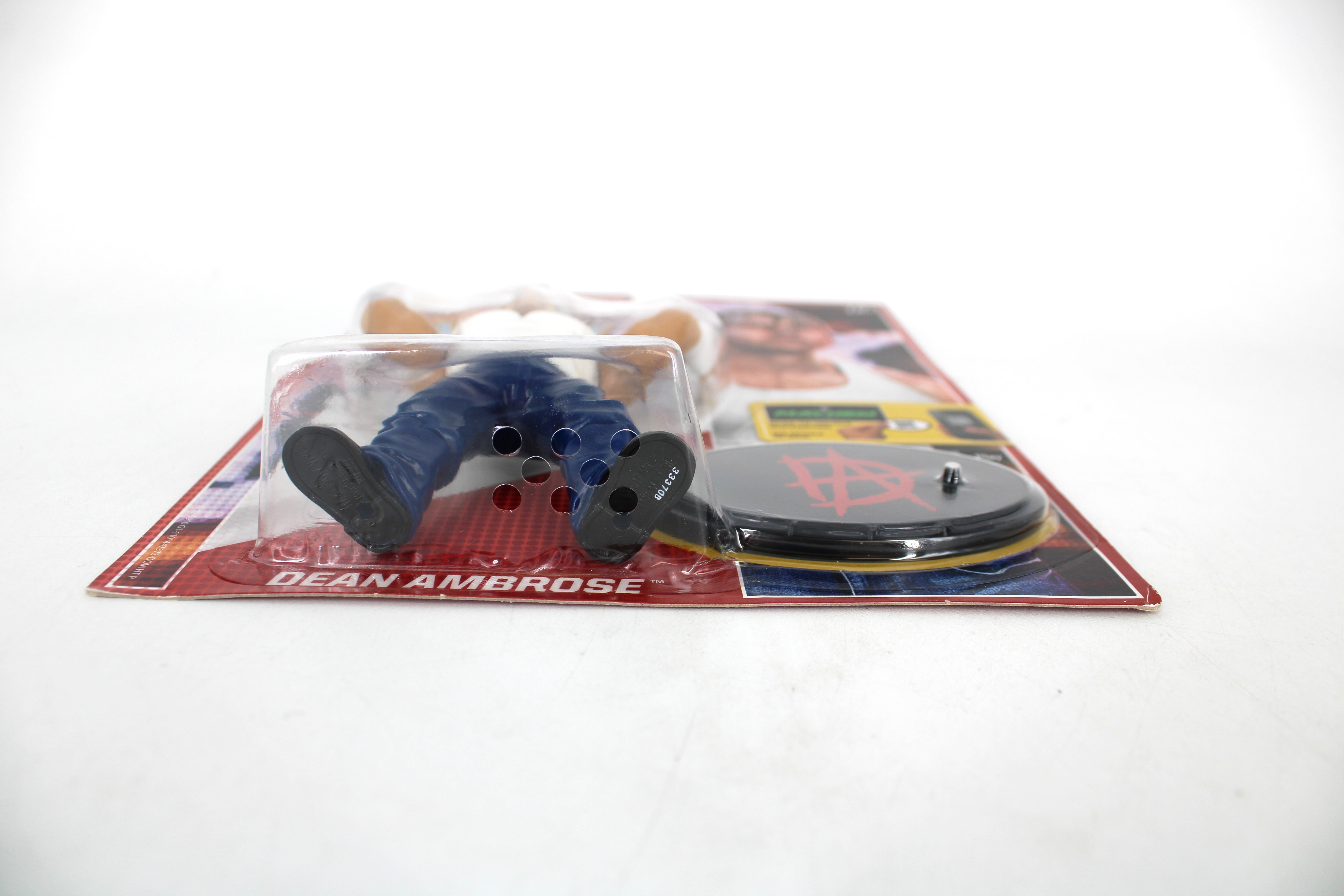 Dean Ambrose WWE Retro Series 3 Action Figure — Bottom-Angle Detail Showing Figure Feet, Base with Ambrose Logo, and Card Nameplate