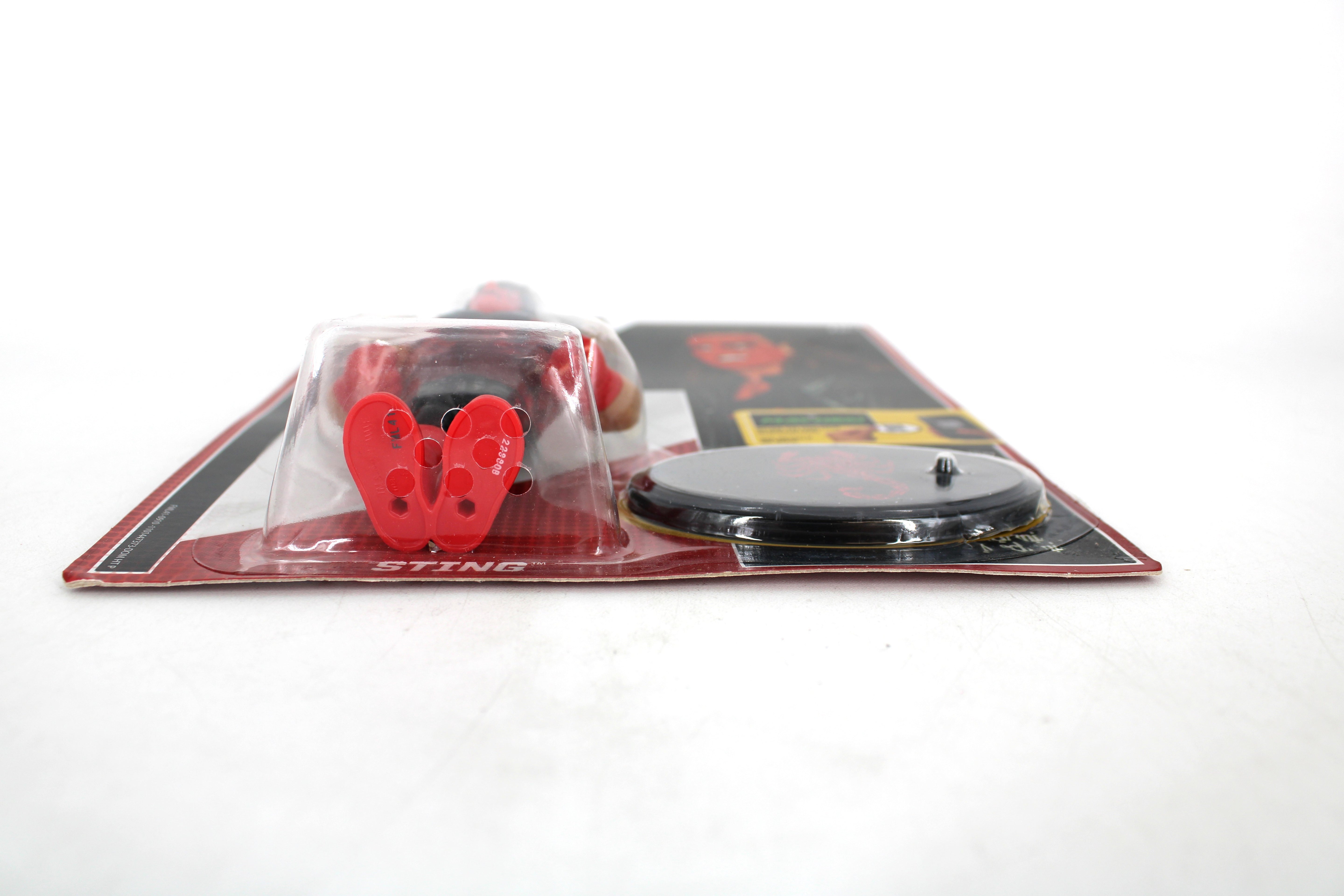 Sting WWE Retro Series Action Figure — Side View Showing Accessories and Display Base on Card