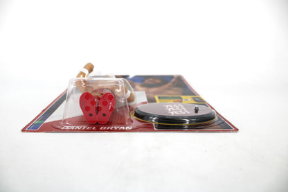 Daniel Bryan WWE Retro Series Figure — Low-Angle Side View Showing Red Accessories and Yes! Display Base on Card
