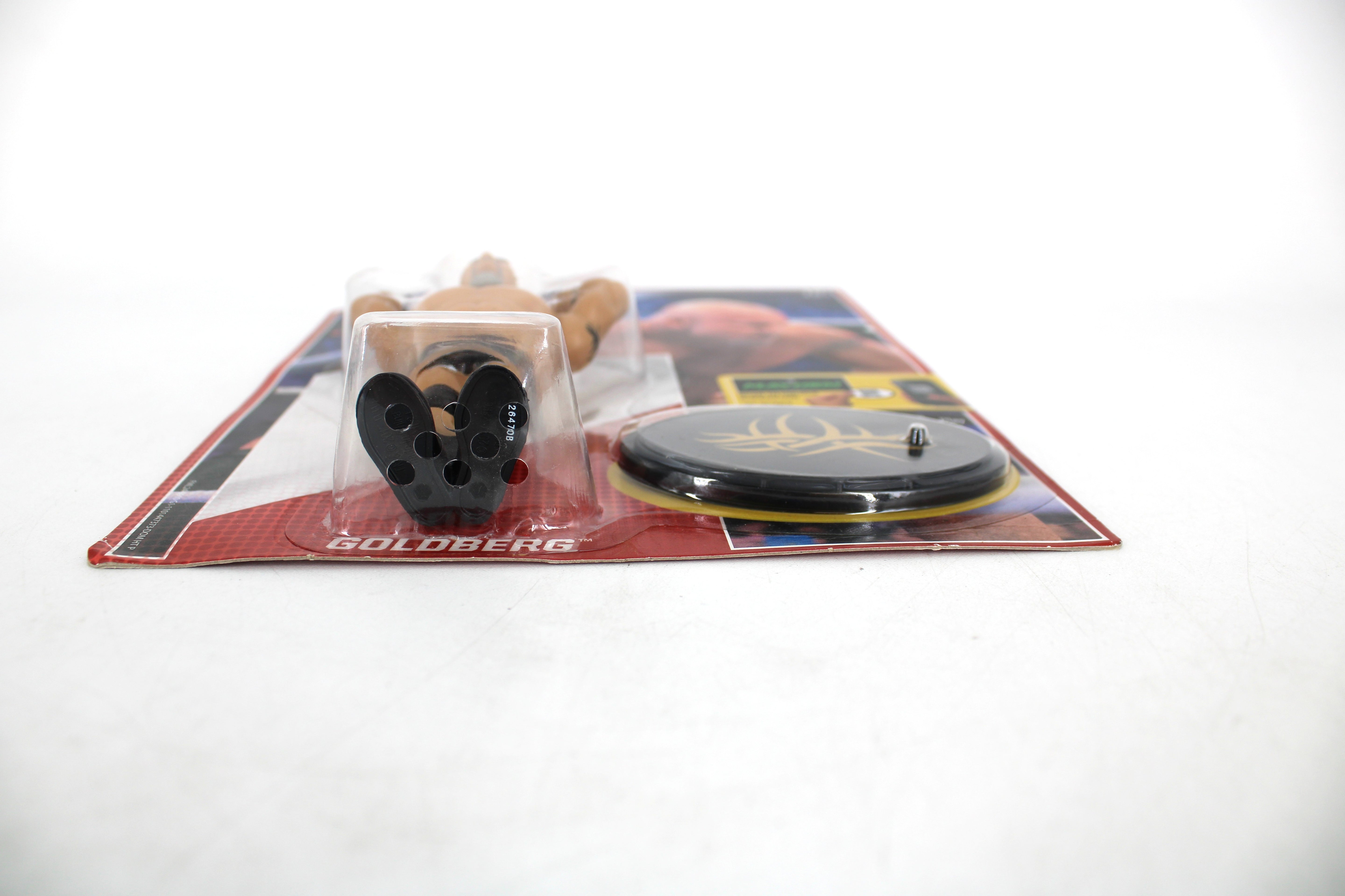 Goldberg WWE Retro Series Action Figure — Package Detail Showing Name Card, Figure Bubble, and Display Stand Close-Up