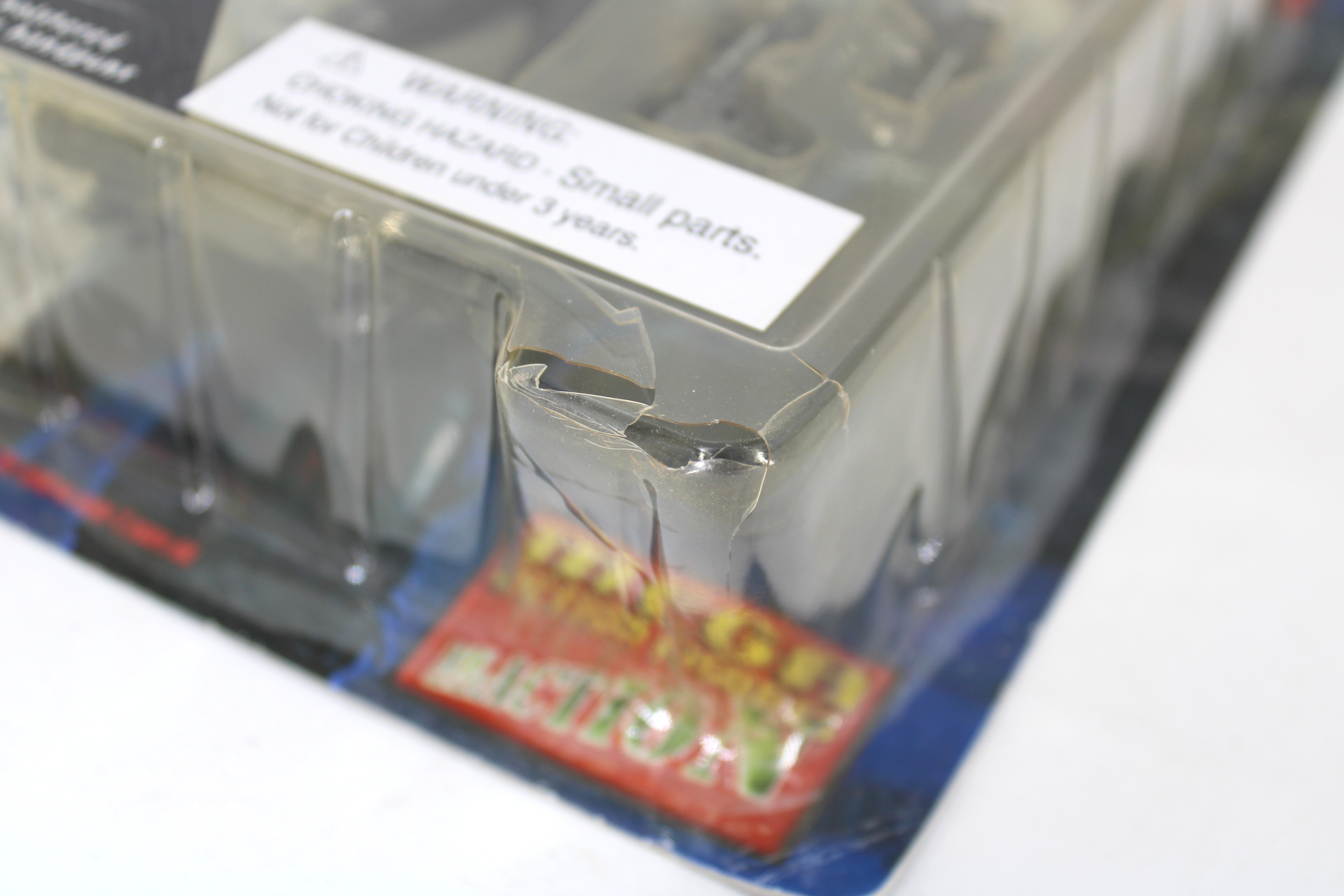 Durham Red (The Scarlet Cantos) 2000 AD Collectors Series Action Figure — Bubble Detail Showing Cracked Plastic Corner with Choking Hazard Warning Label