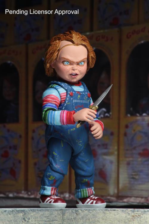 Chucky Child's Play Ultimate 4-Inch Figure — Front View Holding Knife Against Good Guys Box Background