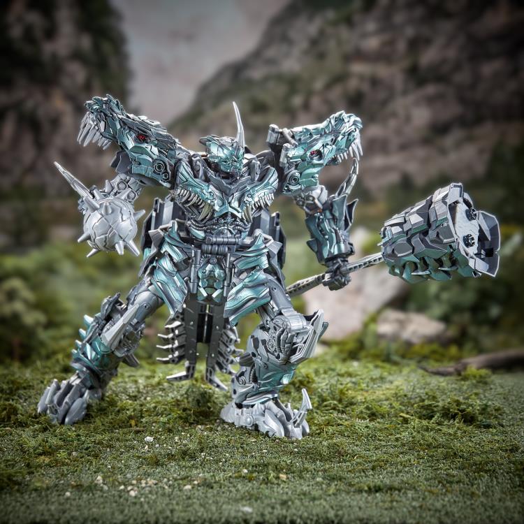Grimlock Studio Series Titan Class Figure — Low Angle Combat Pose with Both Weapons
