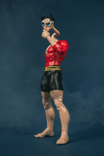 Plastic Man DC Multiverse 7-Inch Figure — Side View with Stretched Neck and Fist Raised