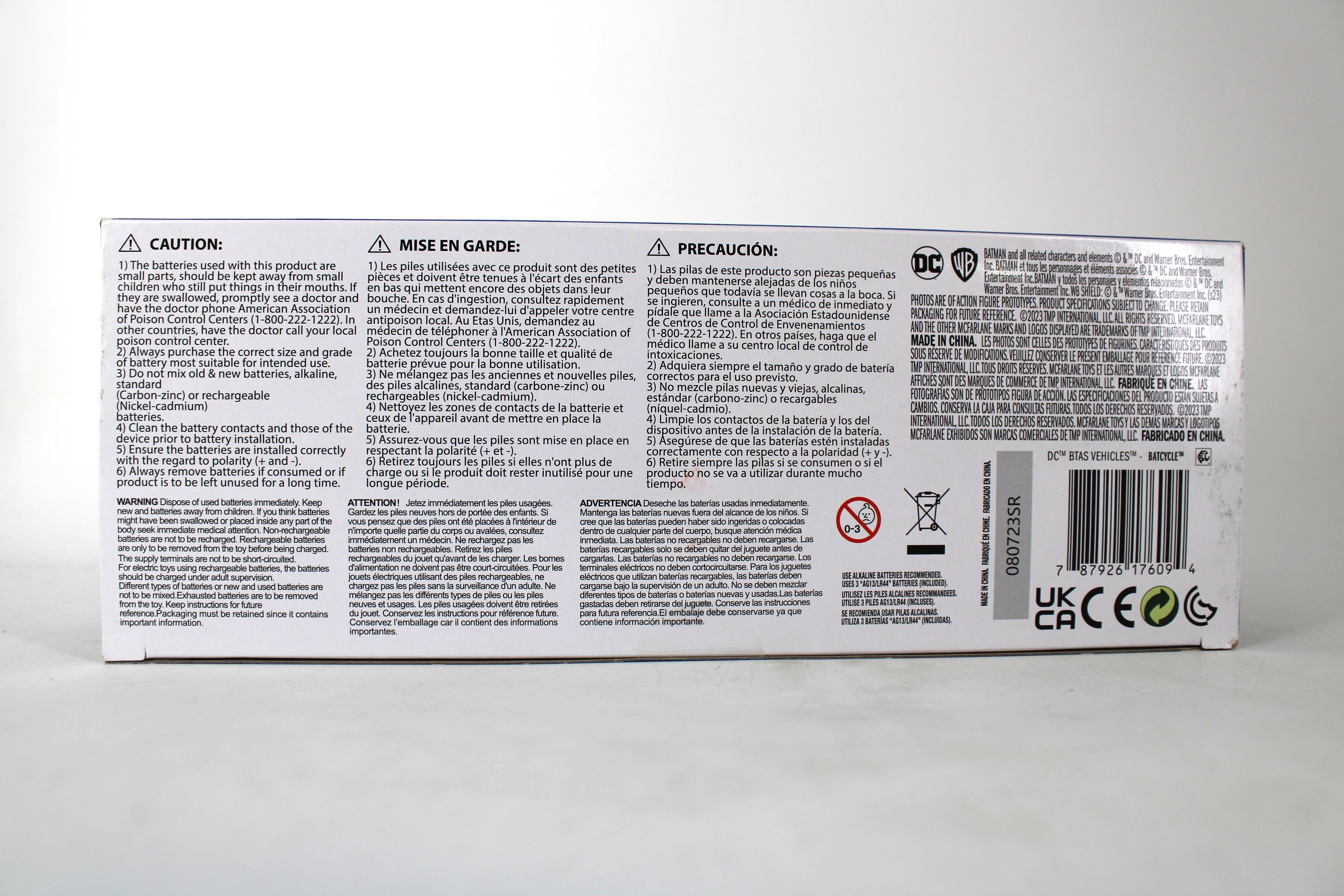 Batcycle Vehicle DC Direct x McFarlane Batman: The Animated Series — Package Detail showing multilingual caution warnings, legal text, and barcode on box bottom panel