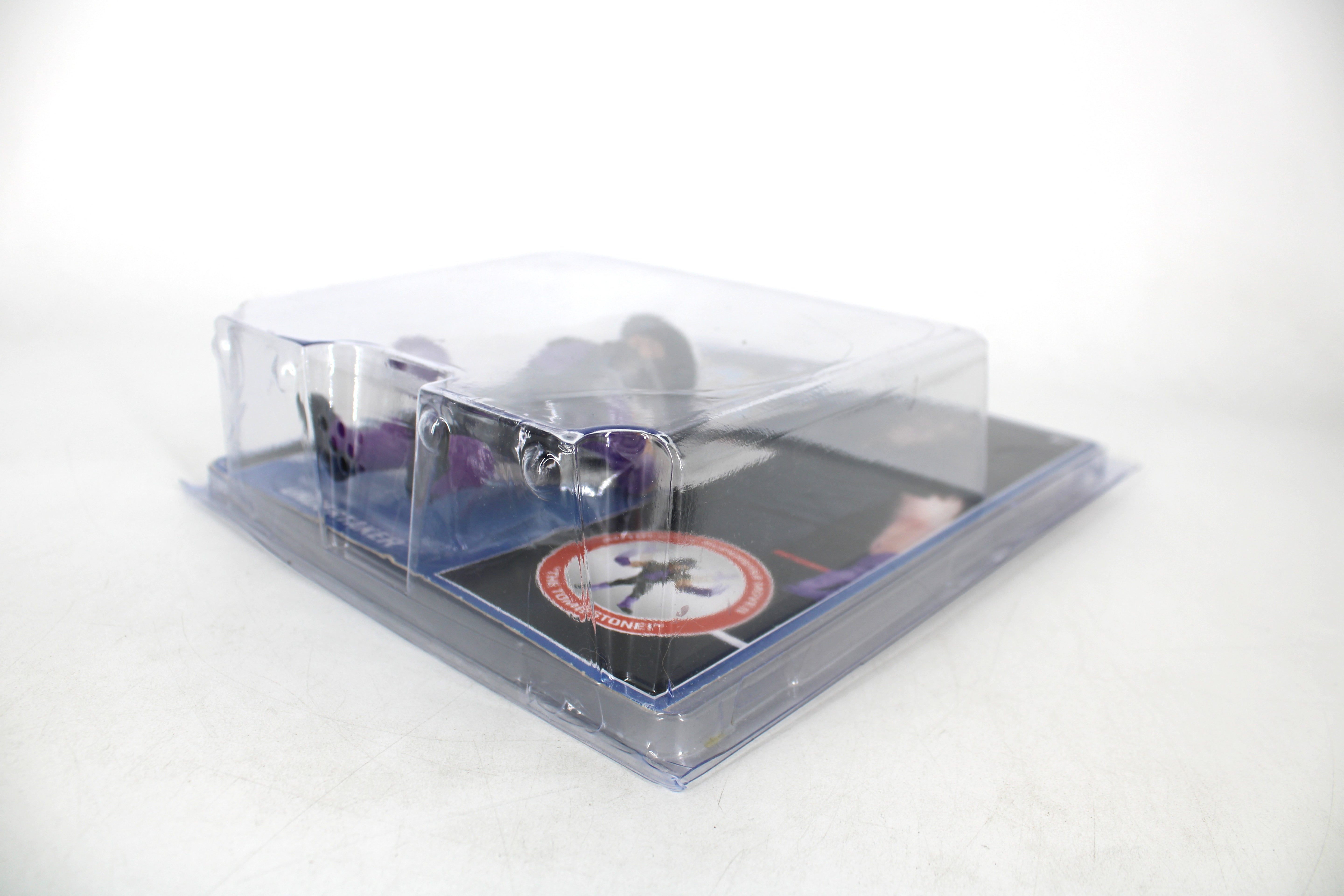 The Undertaker WWE Retro Series Hasbro-Style Action Figure — Angled Front View Showing Clear Clamshell Packaging with Card Art Detail