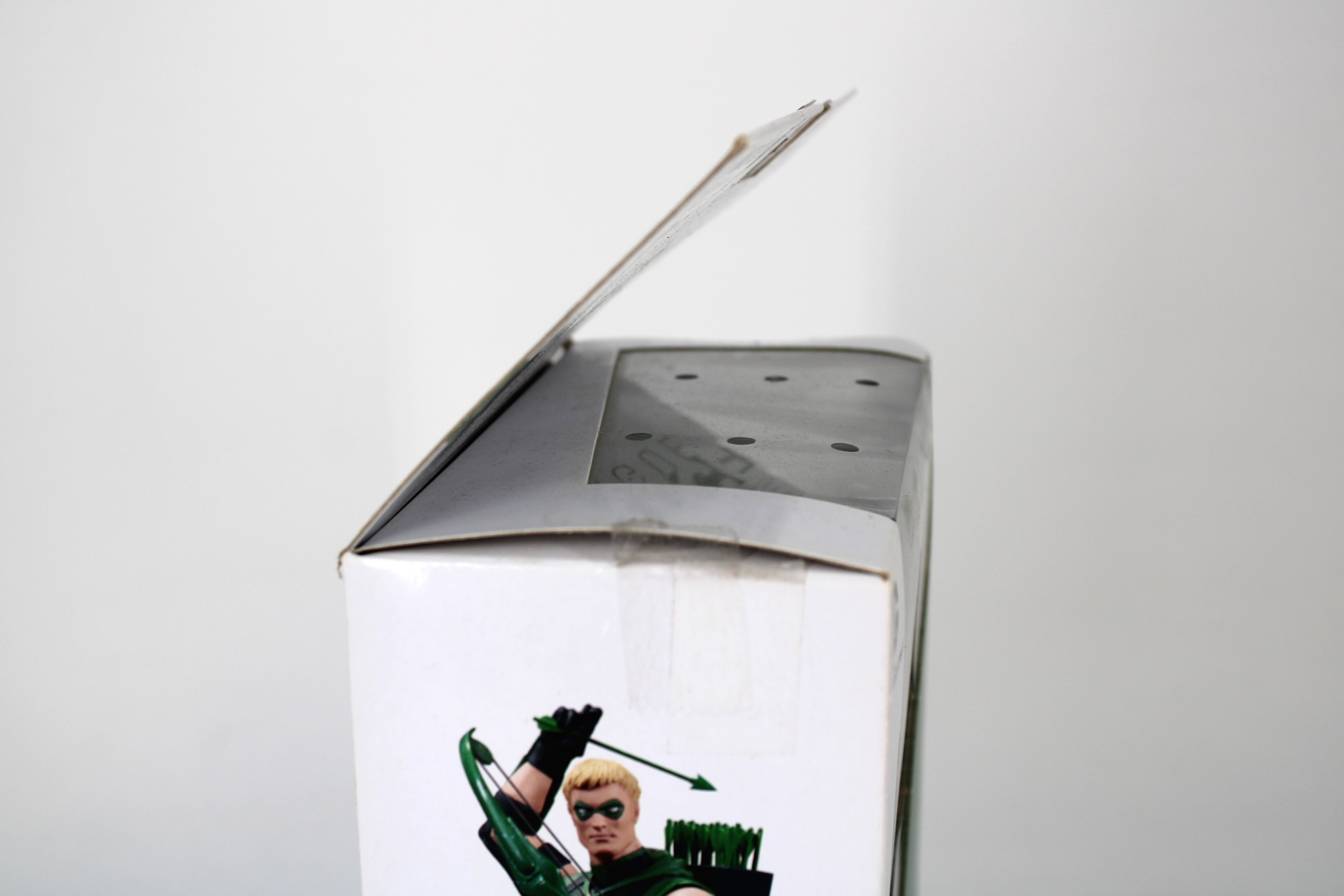 Green Arrow The New 52: Justice League DC Collectibles Action Figure — Side View with Open Box Top and Character Art Visible