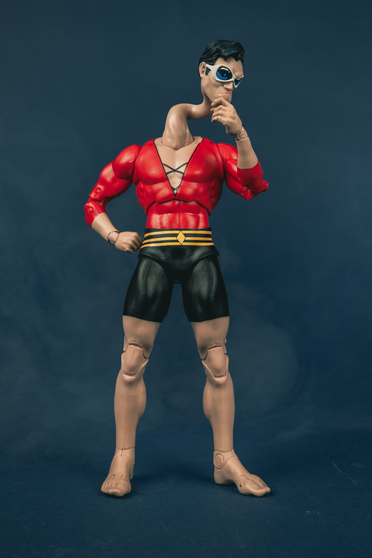 Plastic Man DC Multiverse 7-Inch Figure — Front View with Stretched Neck and Serious Head