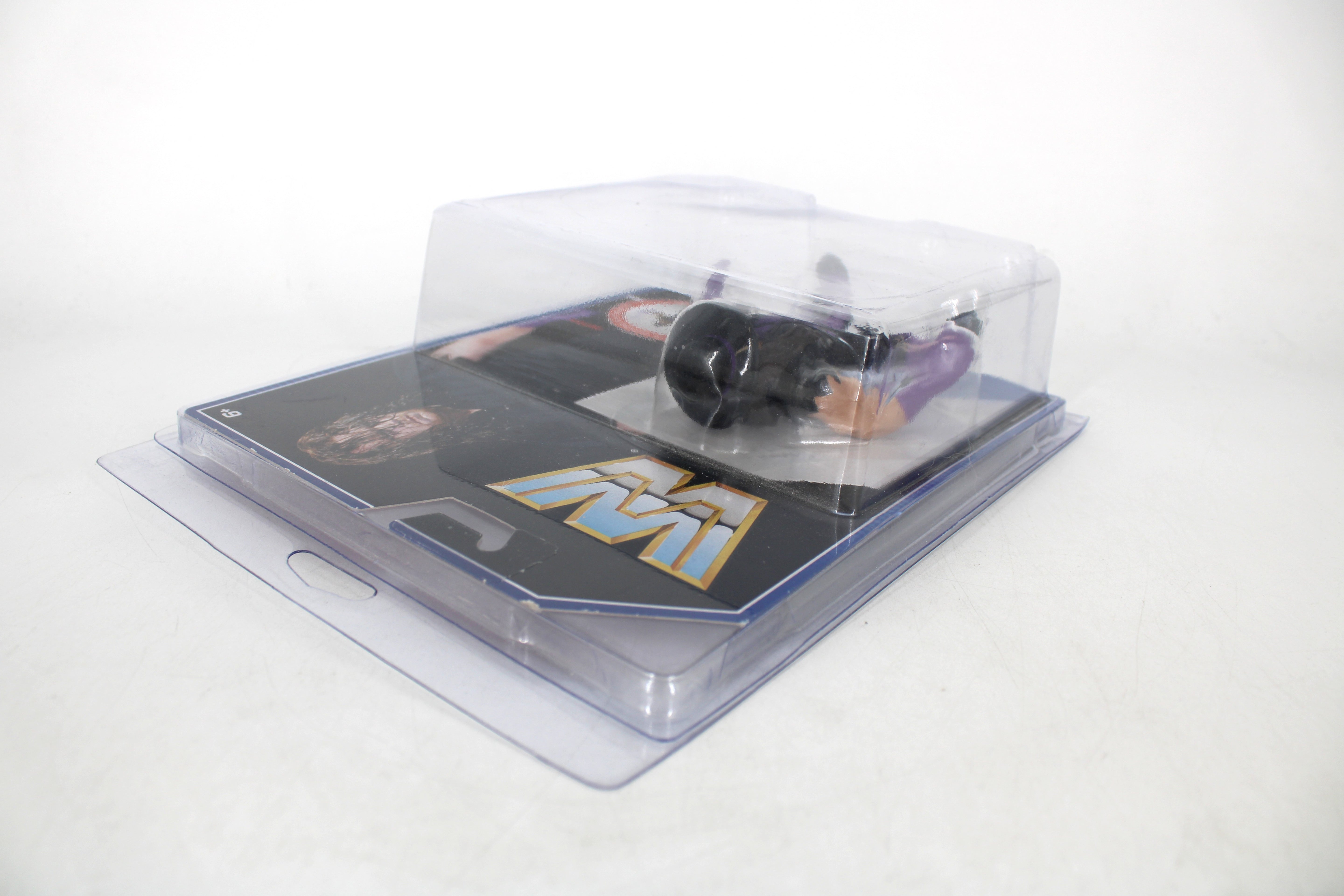 The Undertaker WWE Retro Series Hasbro-Style Action Figure — Side View Revealing Card Back with WWE Logo and Photo Art