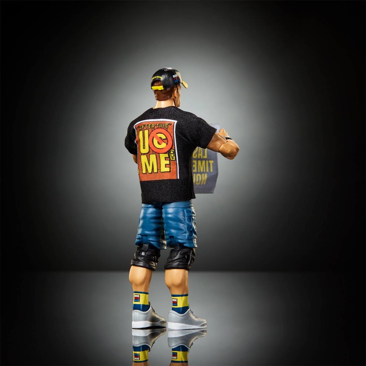 John Cena WWE Elite Top Picks 6-Inch Figure — Back View Showing UC Me T-Shirt Graphic