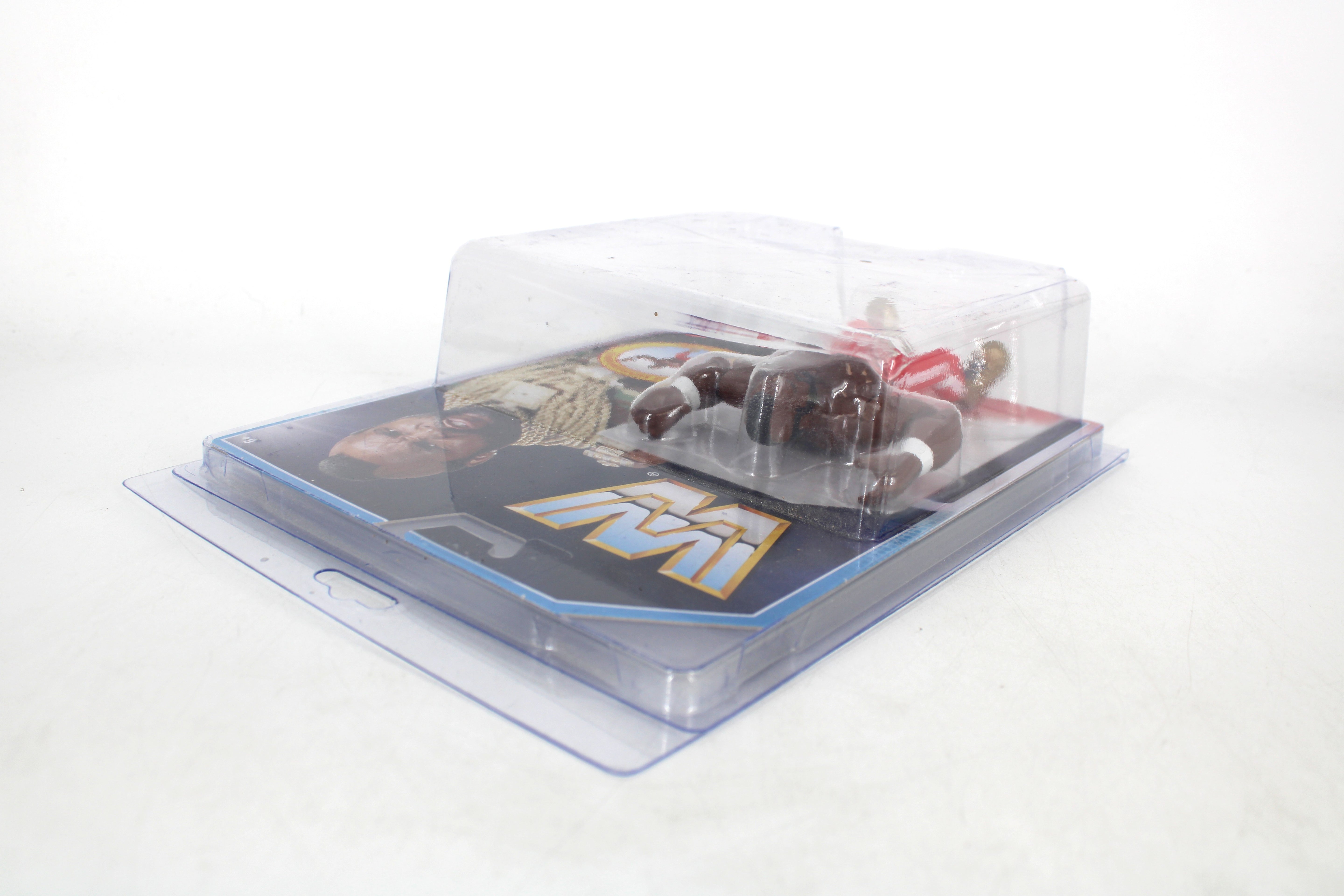 Mr. T WWE Retro Action Figure — Opposite Side View Showing Card Front Art and WWE Logo in Protective Case