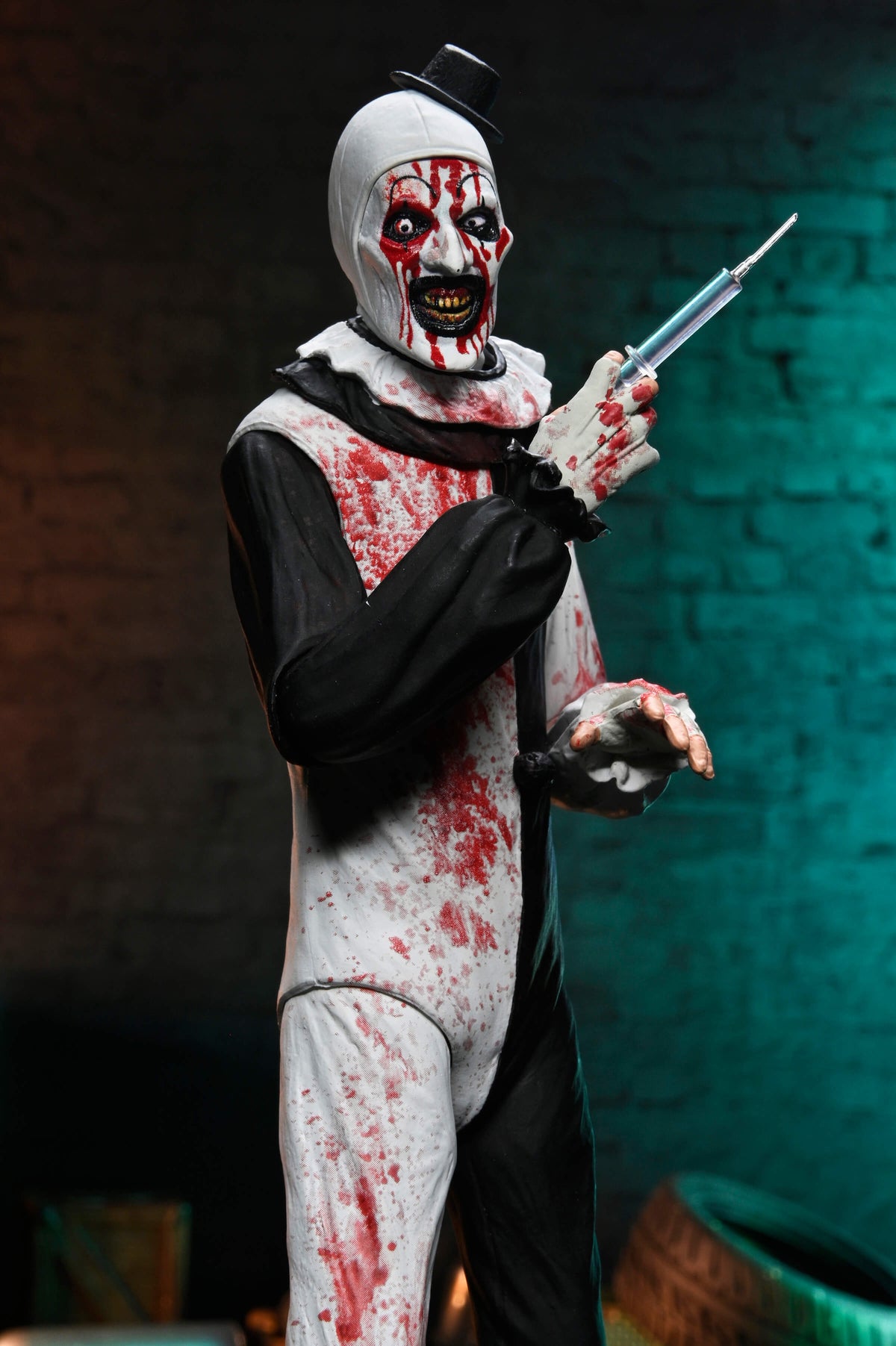 Art the Clown Terrifier 2 Ultimate 7-Inch Figure — Front View Holding Syringe