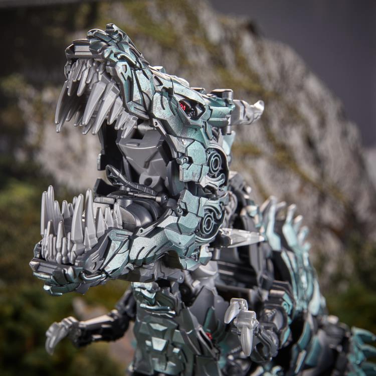 Grimlock Studio Series Titan Class T-Rex Mode — Three-Quarter Rear View Showing Back Armor Plates