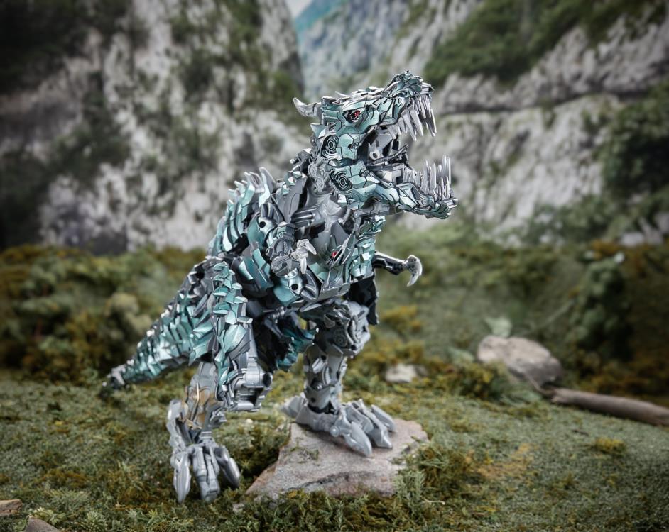 Grimlock Studio Series Titan Class T-Rex Mode — Side View Rearing Up on Rock